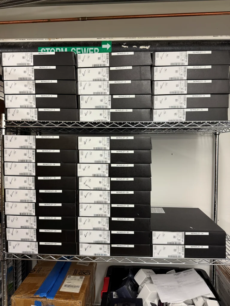 stacks of laptop boxes on shelves