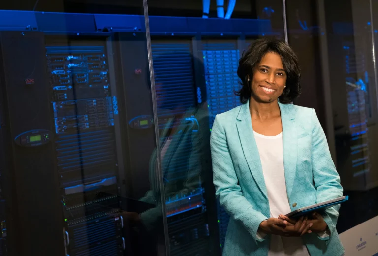 Woman standing in front of server room